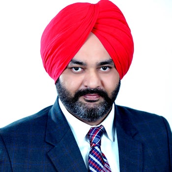 Portrait of Gurinder Gill, Associate.